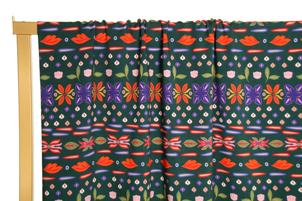 Dark green viscose with fun flowers - €26/m