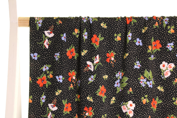 Black cotton with dots and flowers - €26/m
