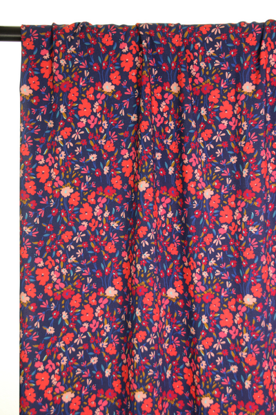 Dark blue viscose with little red flowers - €26/m